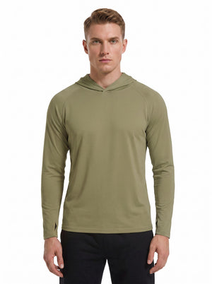 A male model wearing a #green hooded long-sleeve performance shirt and black athletic pants stands against a plain white background. 