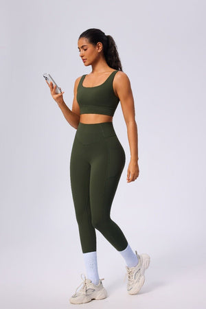 Woman wearing a #green athletic yoga high waist leggings and sports bra outfit 