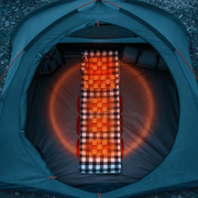 Heated grey camping mat inside a tent with glowing orange heat indicator