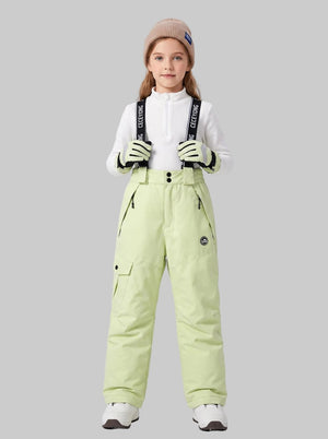 A young girl models a #lemonyellow kids' suspender ski pants.