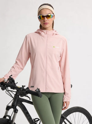 A woman wearing a #lightpink hooded athletic jacket, olive green leggings