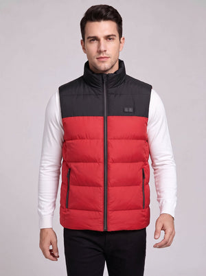 Young handsome Caucasian male model wearing #red heated vest for men, electric heating sleeveless puffer gilet with control button, white long sleeve inner shirt, studio product photo, light gray background
