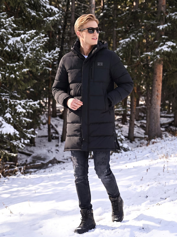 men wear a #Black Mid Length Heated Quilted Jacket in outdoor winter
