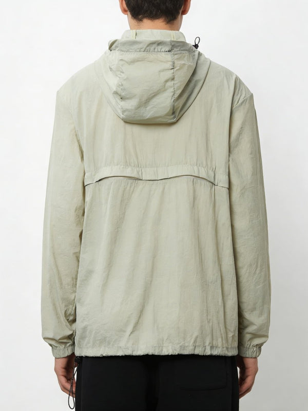 Person wearing a #lightgreen jacket with a hood on a white background