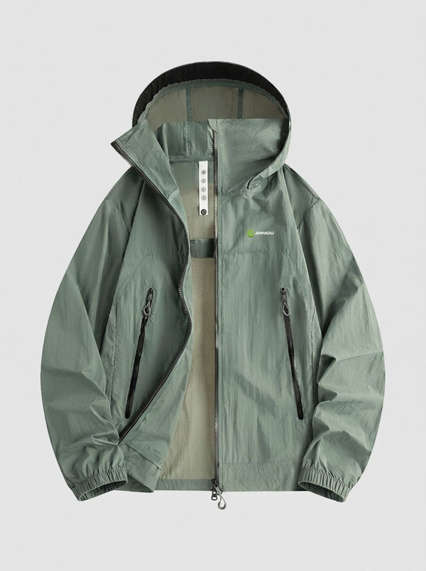 A hooded lightweight jacket in muted sage green with a black zipper and black trim, shown flat against a light gray background.