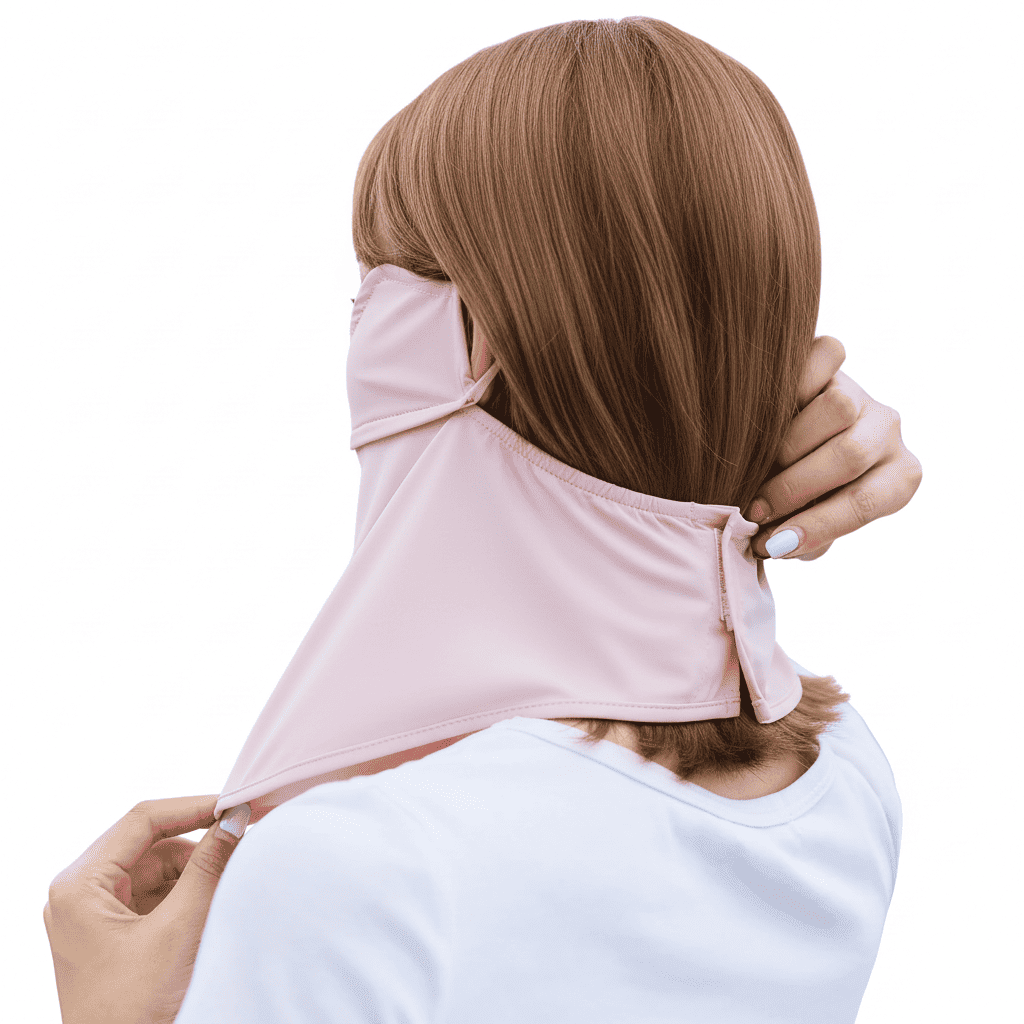 Person wearing a pink neck wrap with a plain white background