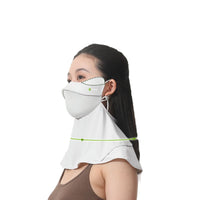 Person wearing a white face mask with a transparent shield over the mouth on a white background