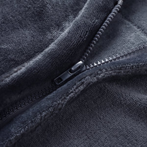 Close-up of sturdy metal zipper on dark grey flannel electric heated shawl, wearable heating blanket zipper detail