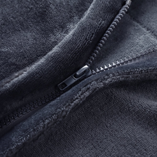 Close-up of sturdy metal zipper on dark grey flannel electric heated shawl, wearable heating blanket zipper detail