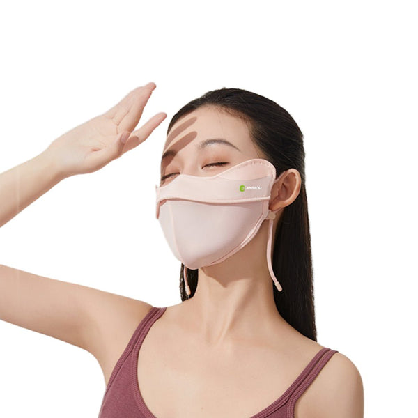Woman wearing a pink face mask with a hand adjusting it on a white  by Anniou