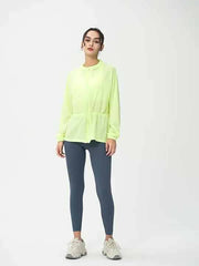Woman wearing a green zip up Jacket with long sleeves
