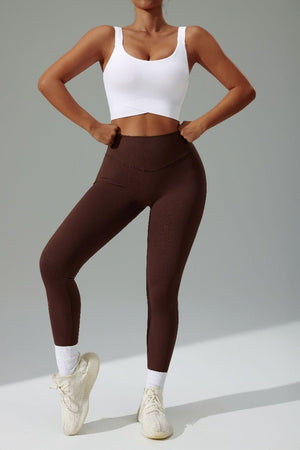 #white High Strength Sports Bra and brown high waist leggings
