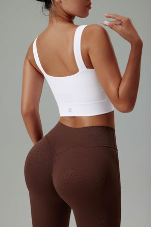 #white High Strength Sports Bra with Anniou Logo and brown high waist leggings