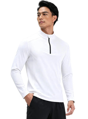 Male model in #white half-zip long sleeve sports top with one hand in pocket, plain background.