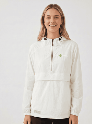 A woman wearing a #white hooded lightweight UV jacket with a half-zip front, black drawstrings, and a small green logo on the left chest, photographed against a plain light gray studio background.