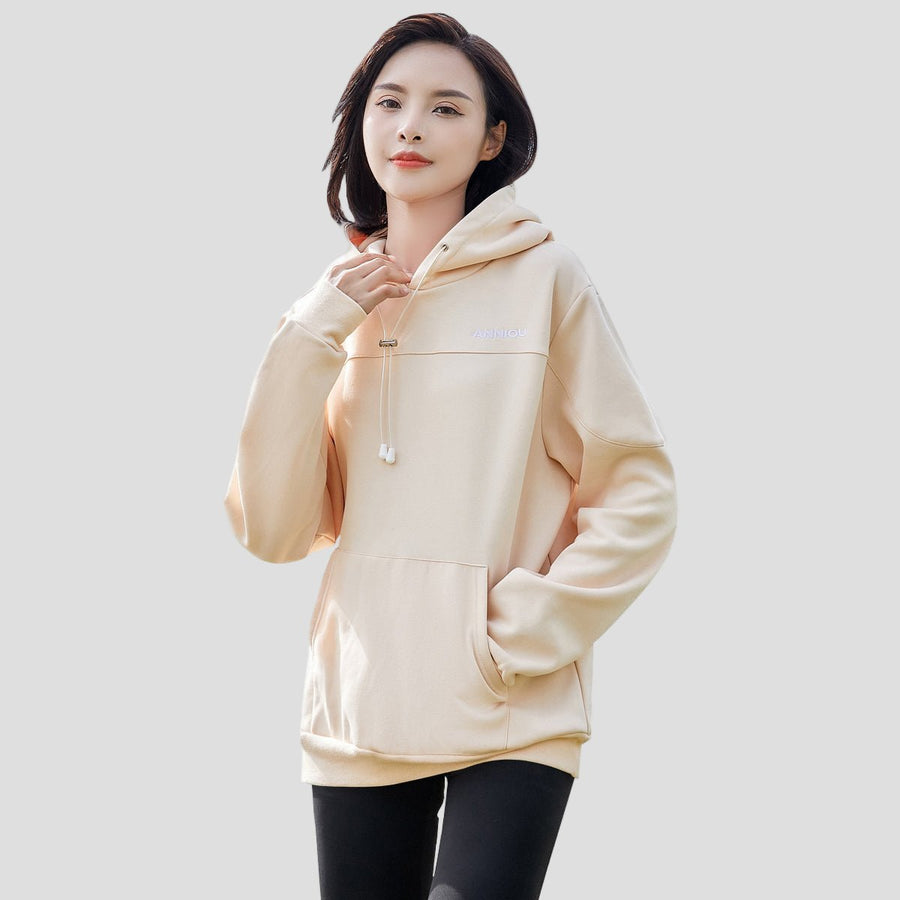 woman wearing a beige pullover mask hoodie