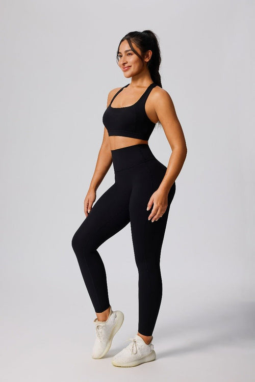 woman wearing a #black shockproof sports bra and high waist leggings