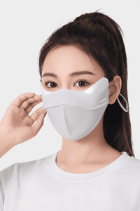 woman wearing a light gray Anti UV face mask 