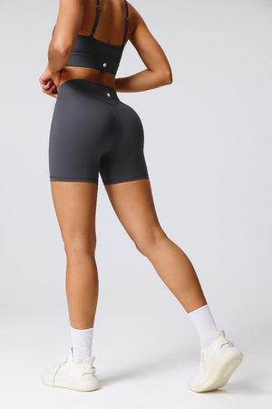 woman wearing #gray athletic shorts and an Anniou sports bra
