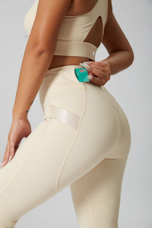 women's #beige leggings and sports bra with pocket