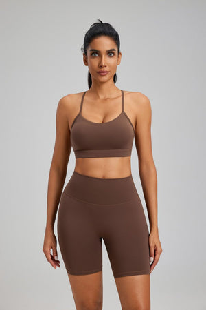 Woman wearing a #brown sports bra and shorts