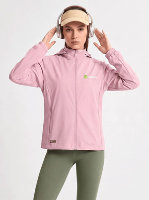 A woman wearing a light #pink hooded athletic jacket with a small green and white logo on the left chest, olive green leggings, a beige visor