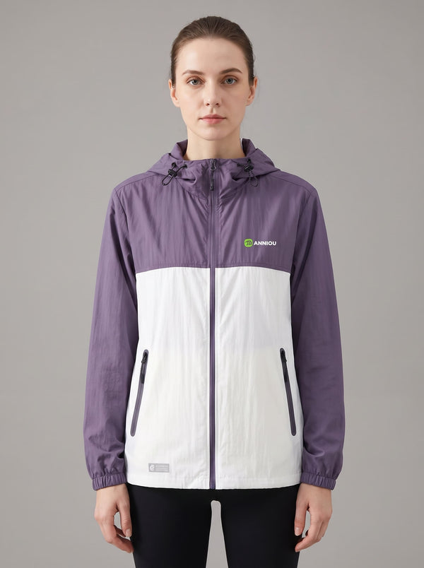 women's Lightweight Breathable UV Jacket with a hooded color-blocked design in purple and white, featuring a full front zipper, zippered hand pockets, and a small green logo on the left chest.